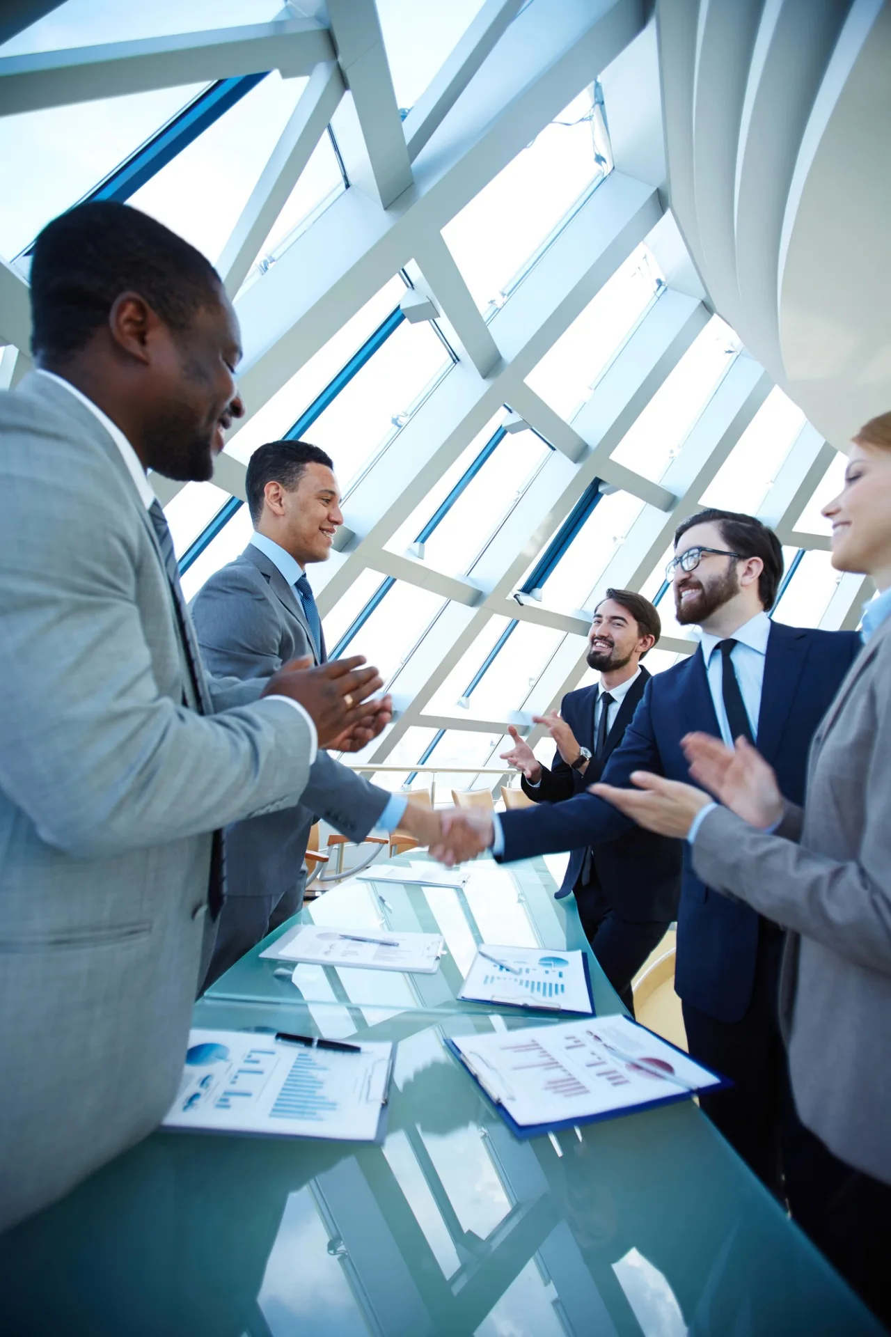 photo of a group of business professionals in Edmonton, meeting to discuss financial reports