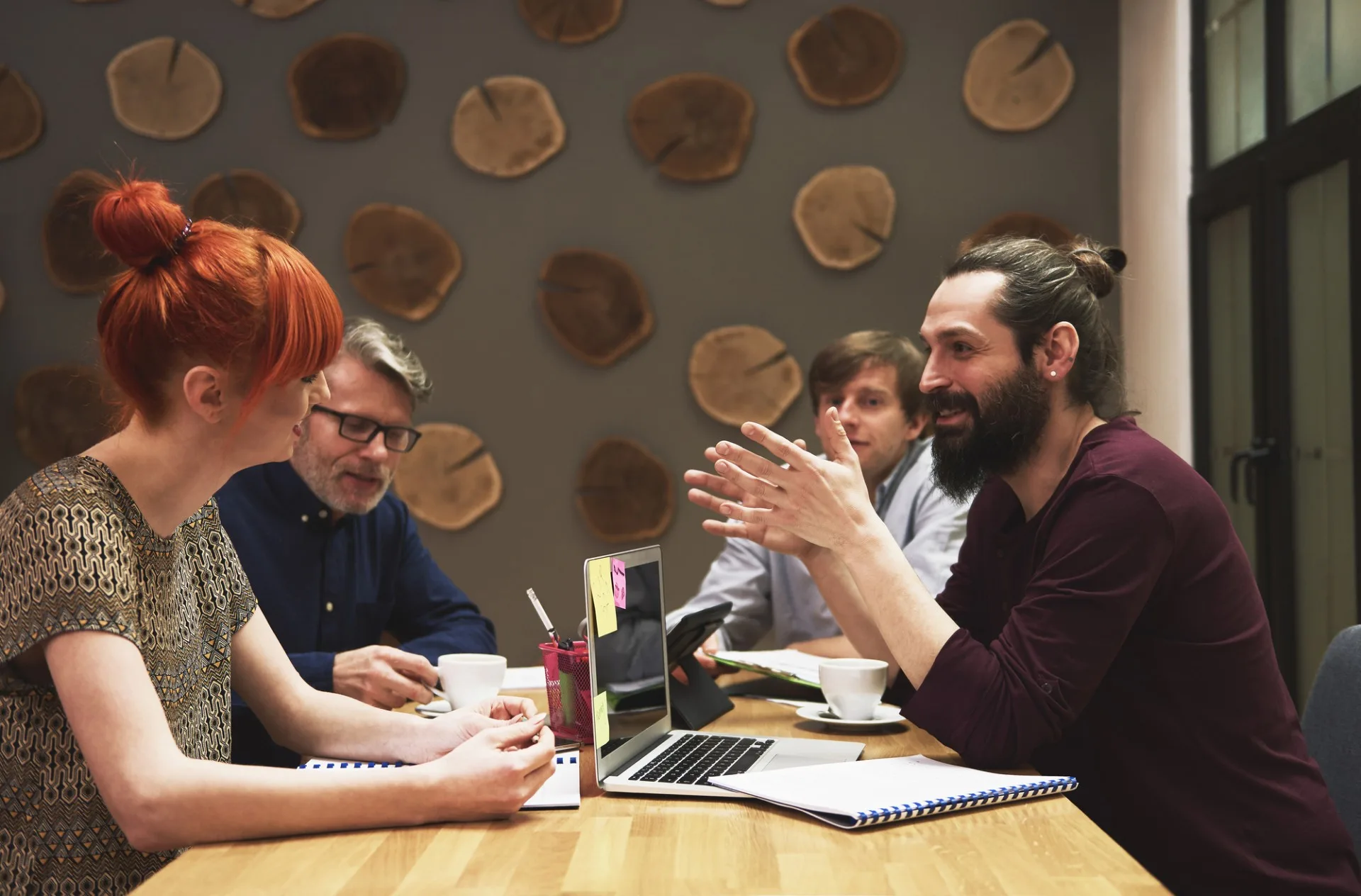 photo of a group of small business professionals discussing business ideas with a clear idea of their current cash flow thanks to their Edmonton bookkeeper