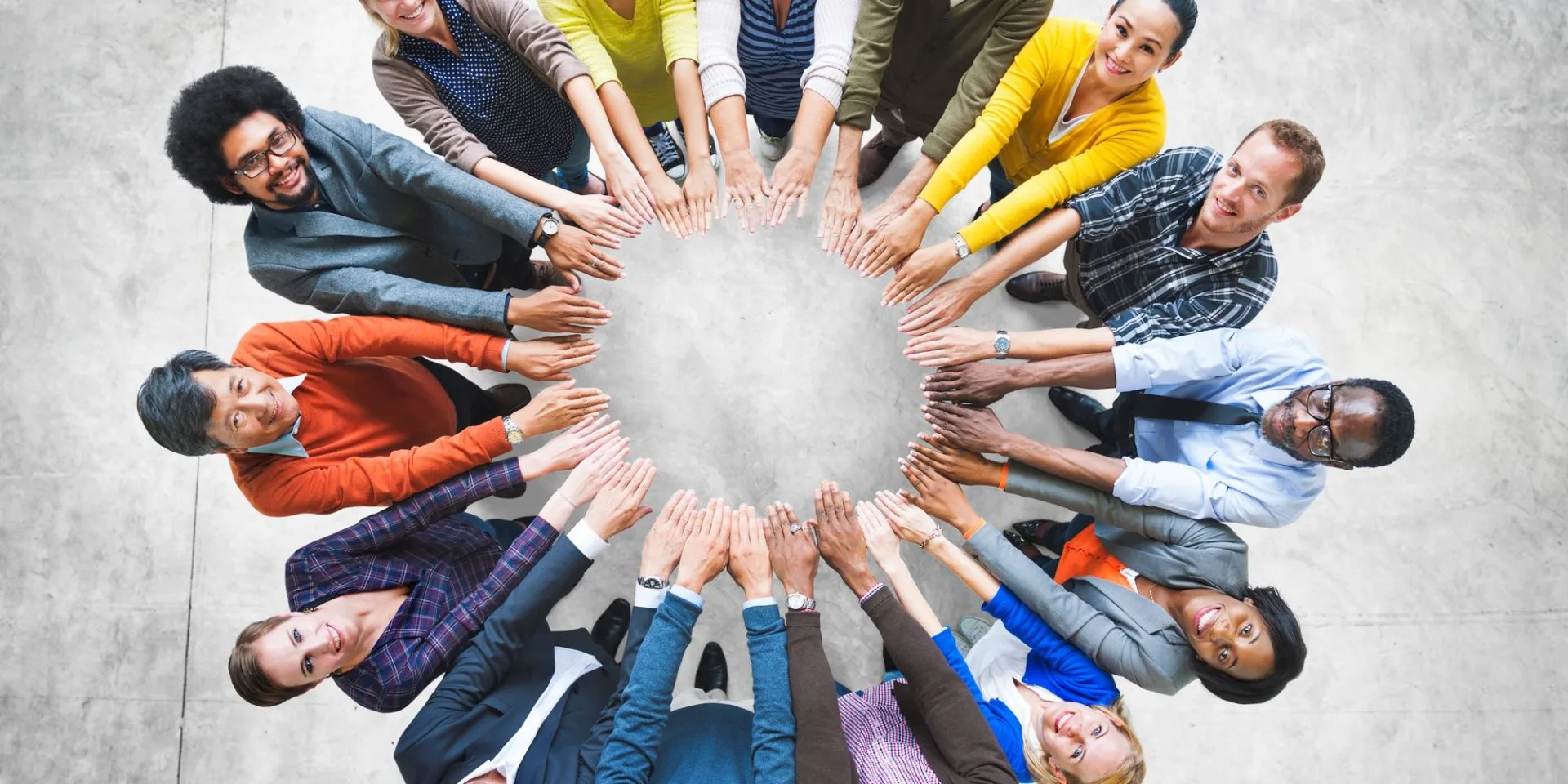 photo of a diverse group of individuals in a circle